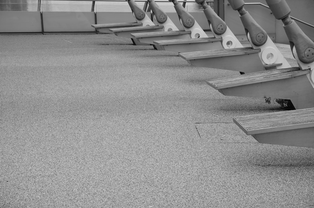 Row of wooden benches with metal supports